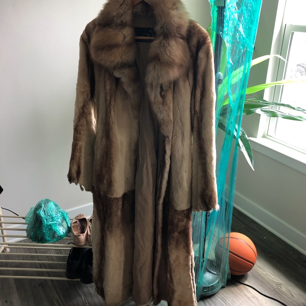 Used fur coat.  Has signs off wear.  Full length.